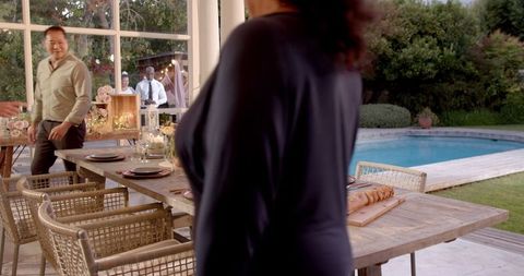 Senior Couples Joyful Reunion at Garden Pool Wedding Celebration