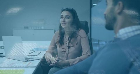 Businesswoman engaging in corporate meeting with colleague