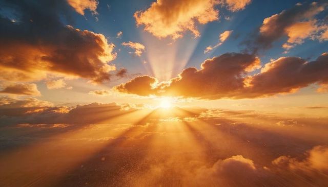 Casting Golden Sunbeams Through Dramatic Cloudscape Over Open Horizon at Sunrise