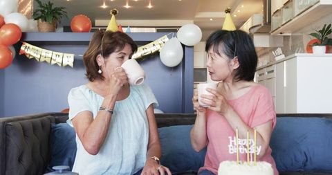 Senior Friends Celebrating Birthday with Coffee and Joyful Conversation