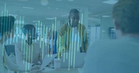 Leader presenting data visualization overlay in collaborative office analytics meeting