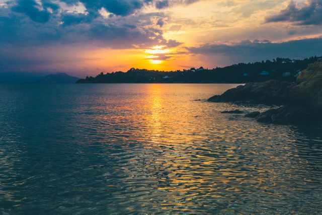 Calm Sea and Island During Sunset - Download Free Stock Photos Pikwizard.com