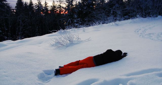 Person Lying in Snowy Landscape at Dusk - Download Free Stock Images Pikwizard.com