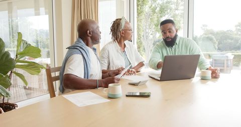 Senior couple meeting financial advisor for retirement planning