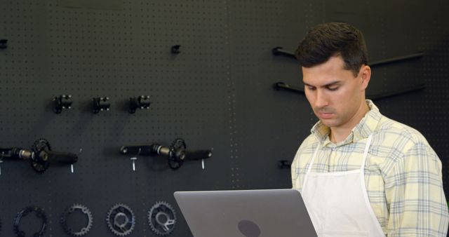 Young Mechanic Using Laptop in Bicycle Repair Shop - Download Free Stock Images Pikwizard.com