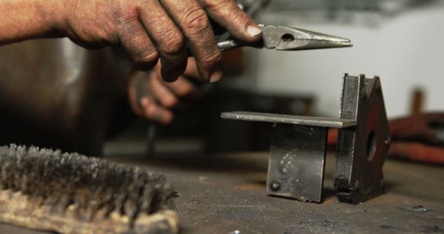 Close-Up of Hands Using Tools in Metal Workshop - Download Free Stock Images Pikwizard.com