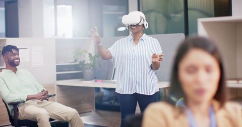 Smiling Team Experiencing Virtual Reality in Modern Office