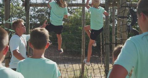 Children Climbing Rope Net in Outdoor Obstacle Course - Download Free Stock Images Pikwizard.com