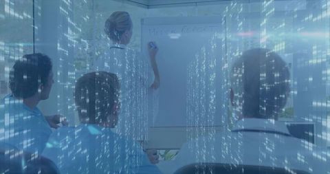 Doctor writing medical report in high-tech meeting room