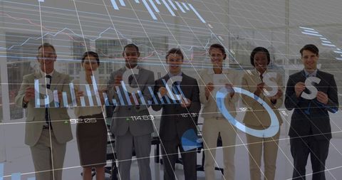 Business team holding letters and displaying financial charts overlay in modern office
