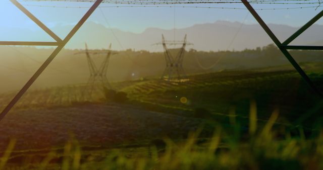 Serene Countryside Landscape at Sunrise with Power Lines and Towers - Download Free Stock Images Pikwizard.com