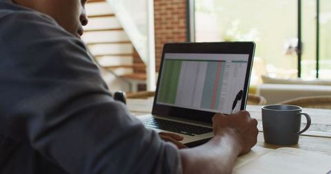 African American Man Analyzing Data at Home Office Desk - Download Free Stock Images Pikwizard.com