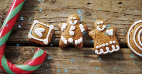 Festive Gingerbread Cookies and Candy Cane with Snowflakes - Download Free Stock Images Pikwizard.com