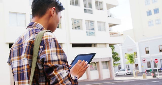 Man Checking Digital Tablet Outdoors Urban Background - Download Free Stock Images Pikwizard.com