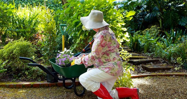 Senior Woman Gardening in Floral Dress and Red Boots - Download Free Stock Images Pikwizard.com