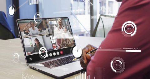 Remote team collaborating in virtual meeting with analytics dashboard on laptop screen
