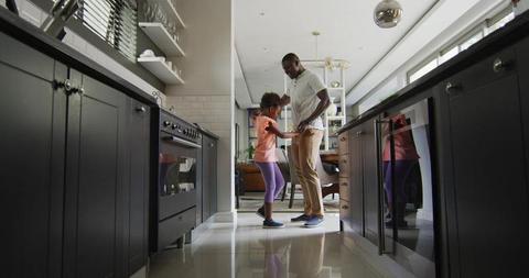 Father Dancing with Daughter in Modern Home Kitchen - Download Free Stock Images Pikwizard.com