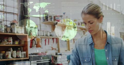 Woman Analyzing Data Visuals in Artisan Coffee Space