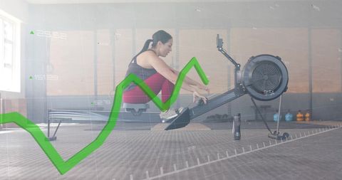 Fitness data analysis woman rowing machine at gym