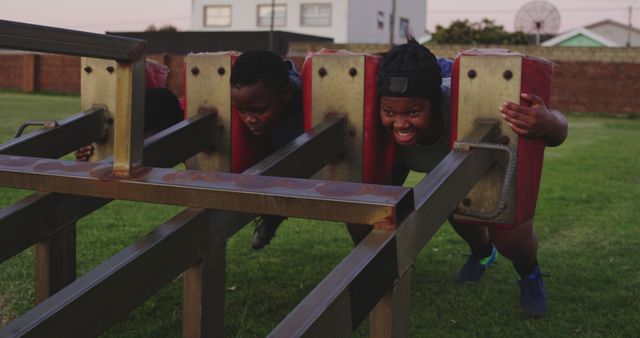 Young Athletes Practicing on Rugby Scrummaging Machine - Download Free Stock Images Pikwizard.com