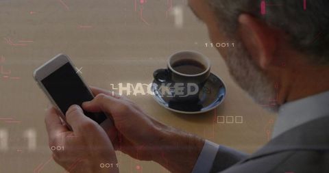Businessman faces smartphone security breach warning with coffee