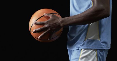 Closeup of Athlete Holding Basketball in Sports Uniform - Download Free Stock Images Pikwizard.com