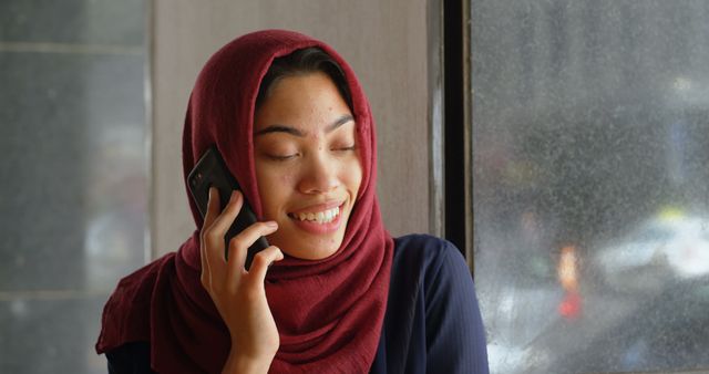 Smiling Hijab-Clad Woman Talking on Smartphone - Download Free Stock Images Pikwizard.com