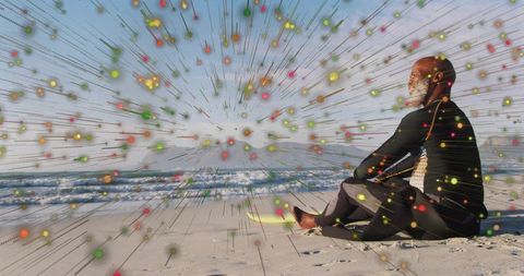 Surfer Meditating Seaside with Dynamic Particle Overlay