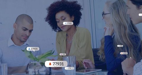Diverse team collaborating around tablet with leader guiding social engagement metrics