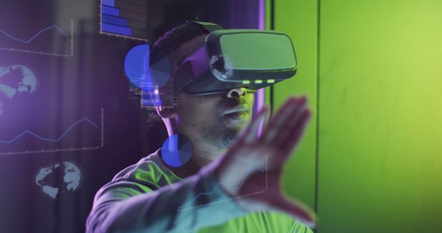 Man Exploring Virtual Reality with VR Headset in Futuristic Environment - Download Free Stock Images Pikwizard.com