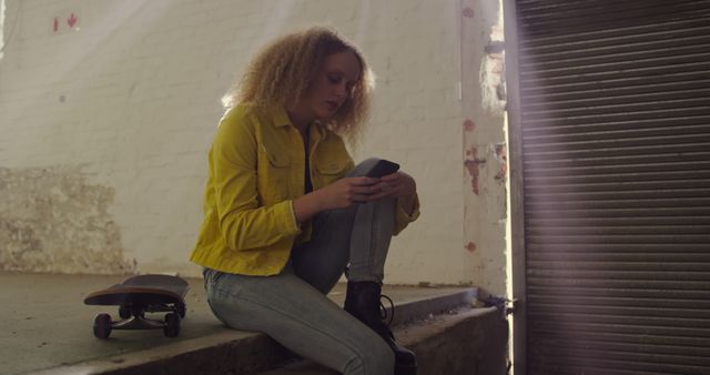 Young Woman Relaxing After Skateboarding in Urban Environment - Download Free Stock Images Pikwizard.com