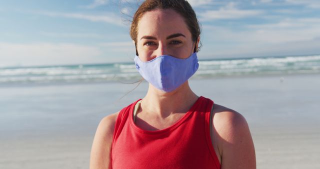 Portrait of caucasian woman wearing face mask at the beach - Download Free Stock Photos Pikwizard.com