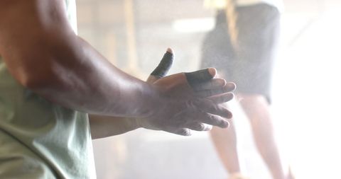 Athlete Preparing for Workout with Gym Chalk on Hands - Download Free Stock Images Pikwizard.com