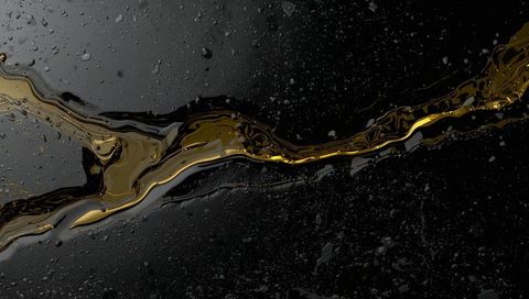 Gold vein flowing across black glossy liquid with reflective droplets and metallic ribbon