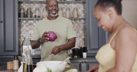Senior Couple Enjoying Cooking Together in Modern Kitchen