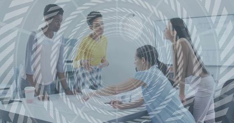 Diverse women collaborating on plans in boardroom with spiral overlay conveying teamwork