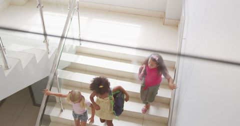Diverse School Girls Descending Stairs Smiling - Download Free Stock Images Pikwizard.com