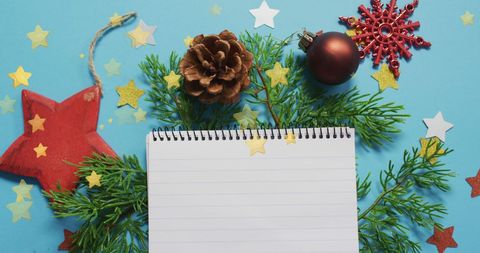 Festive Christmas Notebook Surrounded by Decorations - Download Free Stock Images Pikwizard.com