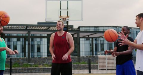 Diverse Group of Friends Playing Basketball Outdoors