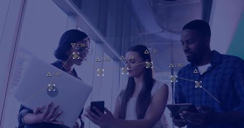 Team collaborating with ar analytics on mobile devices in modern office hallway