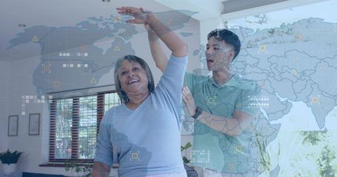 Caregiver assisting senior woman with arm stretch for mobility and home rehabilitation