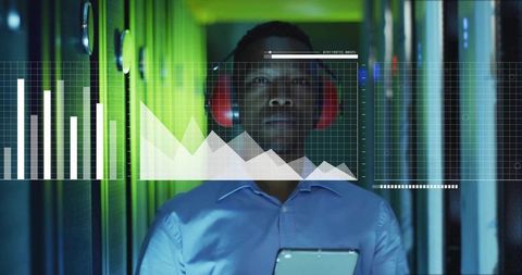 Data center technician monitoring server racks with tablet and headset, neon analytics HUD