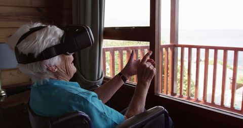 Elderly Woman in Wheelchair Using Virtual Reality for Relaxation