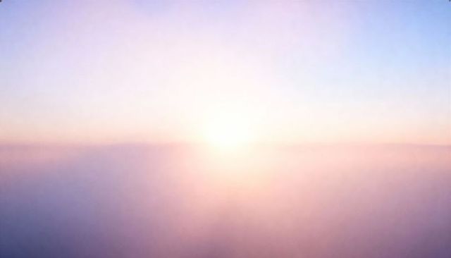 Soft Pastel Sunrise Over Misty Horizon Glowing Dawn Light Minimal Calm Background