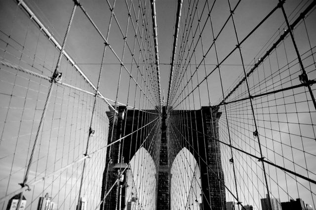 Black and White Perspective of Brooklyn Bridge Cables Against Sky - Download Free Stock Photos Pikwizard.com