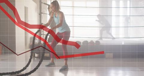Athletic Woman Training with Battle Ropes and Chart Overlay