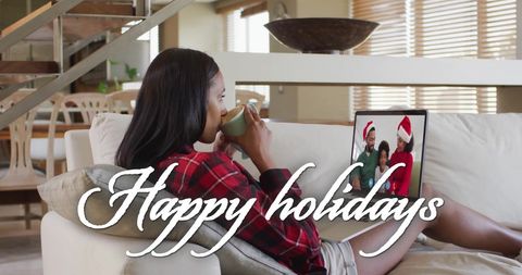 African American Woman Enjoys Virtual Christmas Greeting