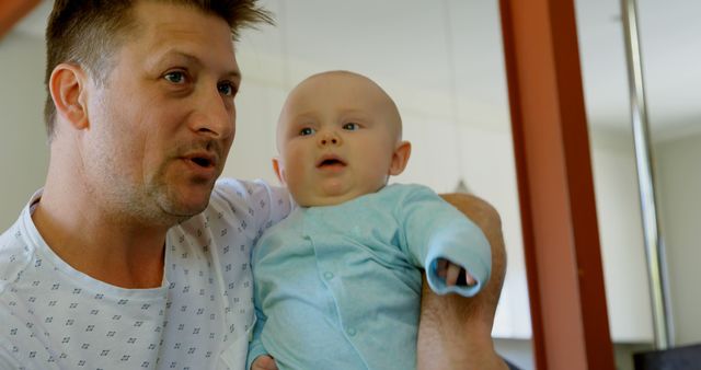 Father Holding Cute Baby in Living Room - Download Free Stock Images Pikwizard.com