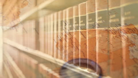 Spinning World Map Overlaying Library Law Books Collection