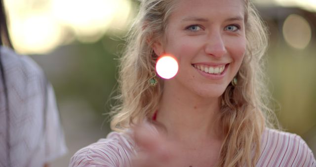 Smiling Woman Enjoying Outdoor Setting with Blurred Background - Download Free Stock Images Pikwizard.com